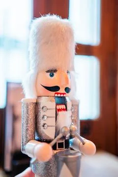 Decorative White Nutcracker With White Fur Bearskin Hat a Silver Costume an.. Stock Photos