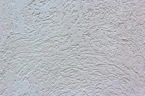 Decorative white wall plaster pattern stylized in bark beetle texture. The white Фото
