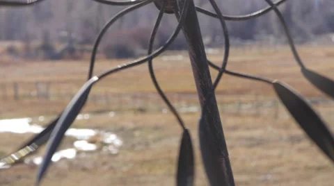 A decorative wind spinner go around in circles Stock Footage 57285436