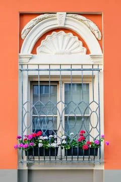 Decorative window with flowers Stock Photos