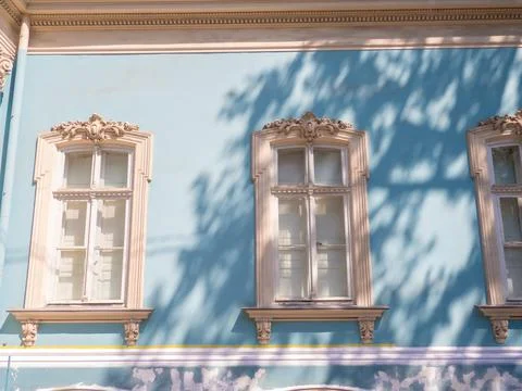 Decorative windows of old building Stock Photos