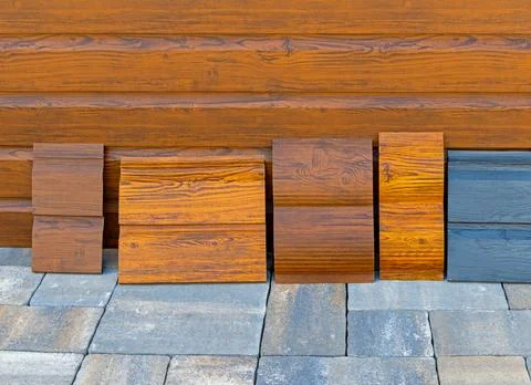 Decorative wood material colourful samples outside on stone background Stock Photos