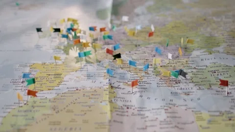 Decorative World Map with Tiny Flags Pinpointing Global Destinations and Points  Stock Footage 287739318