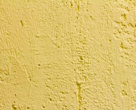 Decorative yellow plaster, texture texture of the wall.Finishing facilities. Stock Photos
