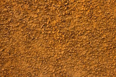 Decorative yellow plaster of a wall Stock Photos