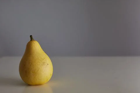 Decorative yellow pumpkin stands on an empty table. place for text. horizontal Stock Photos