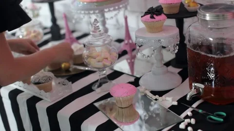 Decorator Decorates a Sweet Table For a Children's Holiday Video stock 77496438