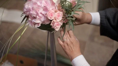 Decorator makes Beautiful wedding arch with  pink flowers Stock Footage 105001395