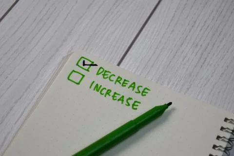 Decrease and Increase write on a book. Supported by an additional services 스톡 사진