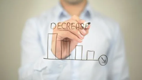 Decrease,  Man writing on transparent screen Stock Photos