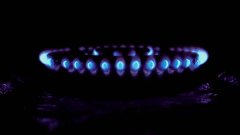 Decreasing and increasing burning of gas with a blue flame in a stove Video stock 134684558