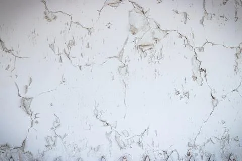 Decrepit white plaster wall. Old background and texture. Stock Photos