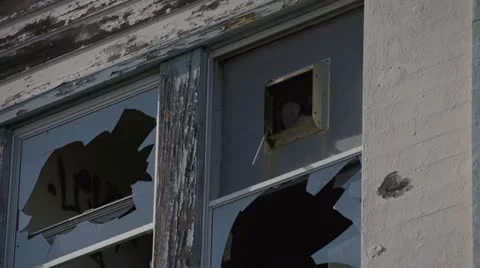 Decrepit Windows Broken Glass Wind Vent Fan Turning Stock Footage 21258966