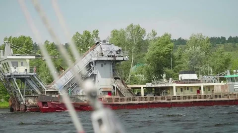 Dedger throws out bottom into barge while cleaning fairway Stock Footage 80066776