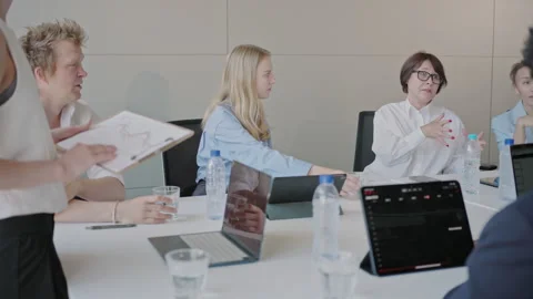 Dedicated business session emphasizing teamwork and collaboration with a variety Video stock 278386725