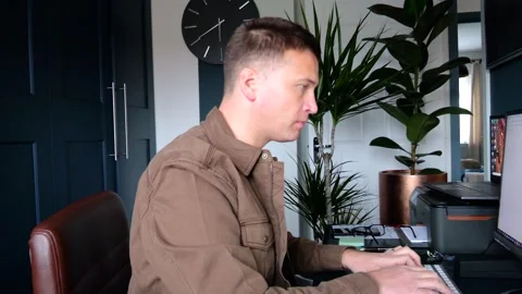 Dedicated Caucasian Man Working Remotely in Home Office - 4K Stock Footage 257975288