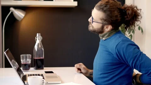 Dedicated Caucasian programmer typing on laptop and having backpain. Stock Footage 141379861