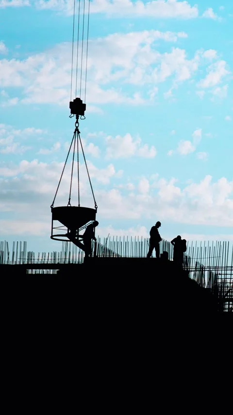Dedicated Construction Workers Actively Engaged in Their Work Beneath a Bright Stock Footage 291710330