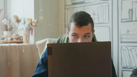 Dedicated developer working through night under warm lighting. Committed Video stock 338437542