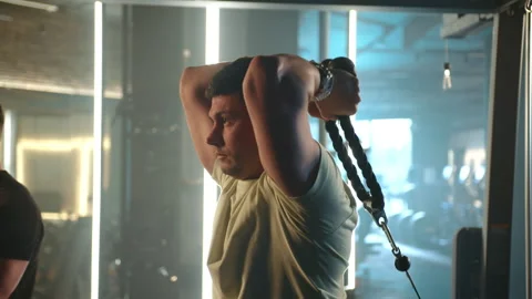 Dedicated Duo Training on Crossover Station for Arms and Back Muscles Stock Footage 268841449