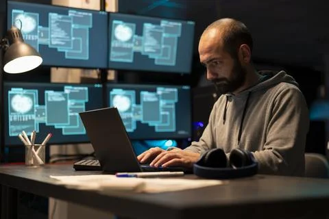 Dedicated Male Programmer Working on Secure Software Stock-Fotos