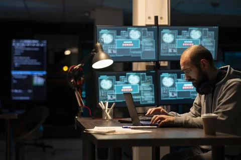 Dedicated Male Programmer Writing Secure Software Code 库存照片