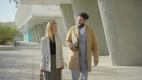 Dedicated professionals are engaging in fruitful conversation outdoors in an Stock Footage 305518587