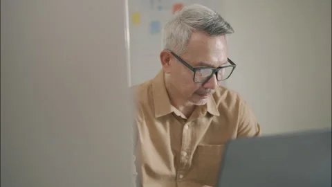 Dedicated Senior Professional Working Quietly On Technology Task. Stock Footage 308163764
