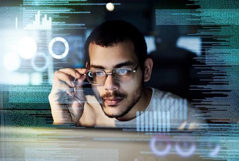 Dedicated to software development. a male computer programmer working on new Foto stock
