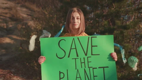 Dedicated supporter champions climate change measures using handcrafted signs Stock Footage 332623085