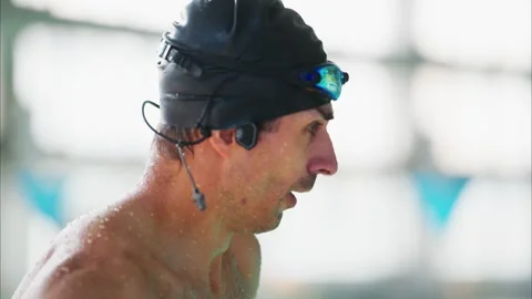 A Dedicated Swimmer Preparing for a Competition, Showcasing Focus, Determination 스톡 동영상 317078910