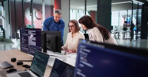 Dedicated Team Of Programmers Collaborates On New Website Design Project Stock Photos