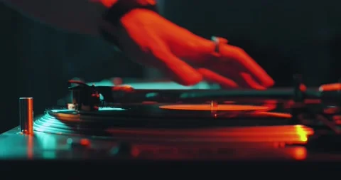 Deejay playing music, put needle on vinyl record spinning on dJ turntable during Stock Footage 158119718