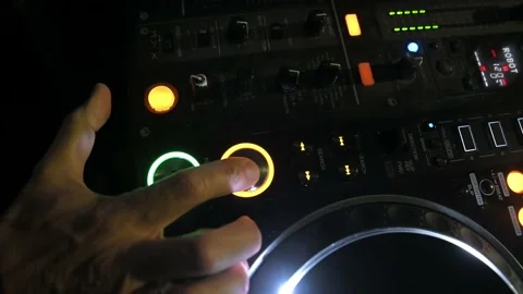Deejay who presses the play button on a dj plate during the evening at the cl Stock Footage 221252840