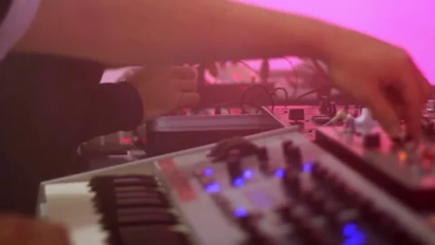 Deejays adjusting and checking sound equipment before night rave in nightclub Video stock 75936469