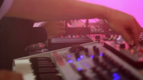 Deejays adjusting and checking sound equipment before night rave in nightclub Video stock 75938443