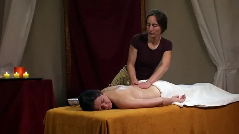 Deep back oil massage for a young woman Stock Footage 70878170