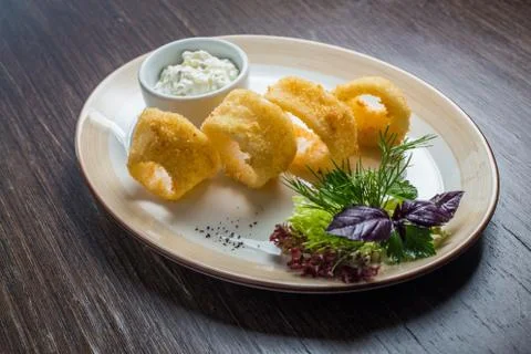 Deep batter fried squid rings calamari Stock Photos