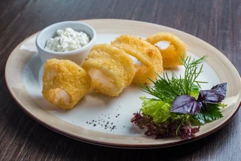 Deep batter fried squid rings calamari Stock Photos