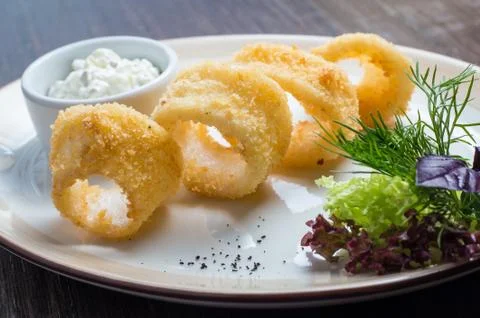 Deep batter fried squid rings calamari Stock Photos