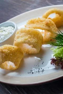 Deep batter fried squid rings calamari Stock Photos