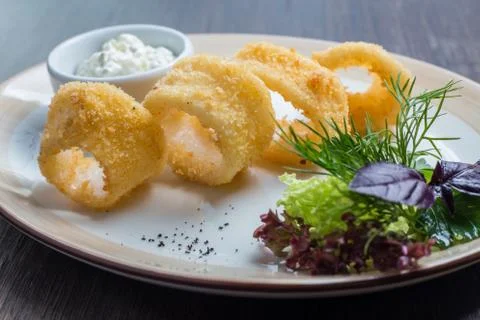 Deep batter fried squid rings calamari Stock Photos