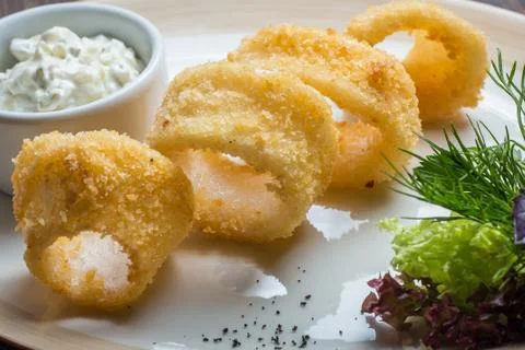 Deep batter fried squid rings calamari Stock Photos