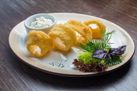 Deep batter fried squid rings calamari Stock Photos