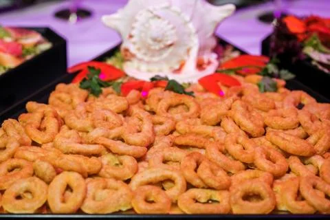 Deep batter fried squid rings calamari in plate Stock Photos