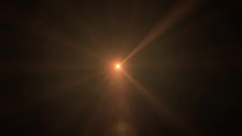 Deep black backdrop features a vivid light burst Video stock 338302077