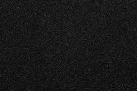 Deep black grainy texture of paint or plaster for background Stock Photos
