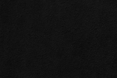 Deep black grainy texture of paint or plaster for background Stock Photos