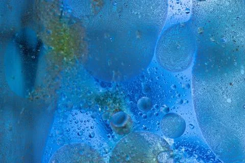 Deep blue abstract liquid background with soft ethereal oil and water mix Stock Photos