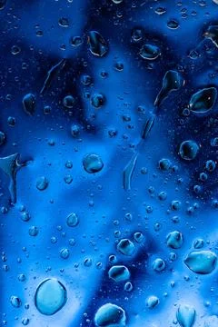 Deep blue aesthetic background with heavy water drops on dark surface Stock Illustration
